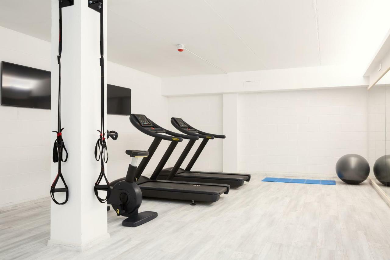 Toscana Charme Resort Tirrenia Kültér fotó A Peloton bike in a gym
