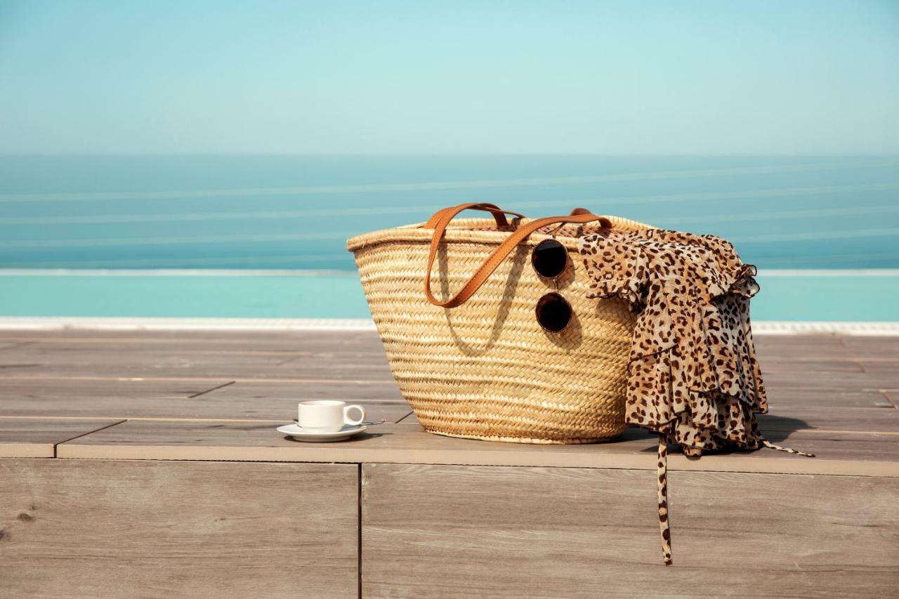 Toscana Charme Resort Tirrenia Kültér fotó A straw beach bag